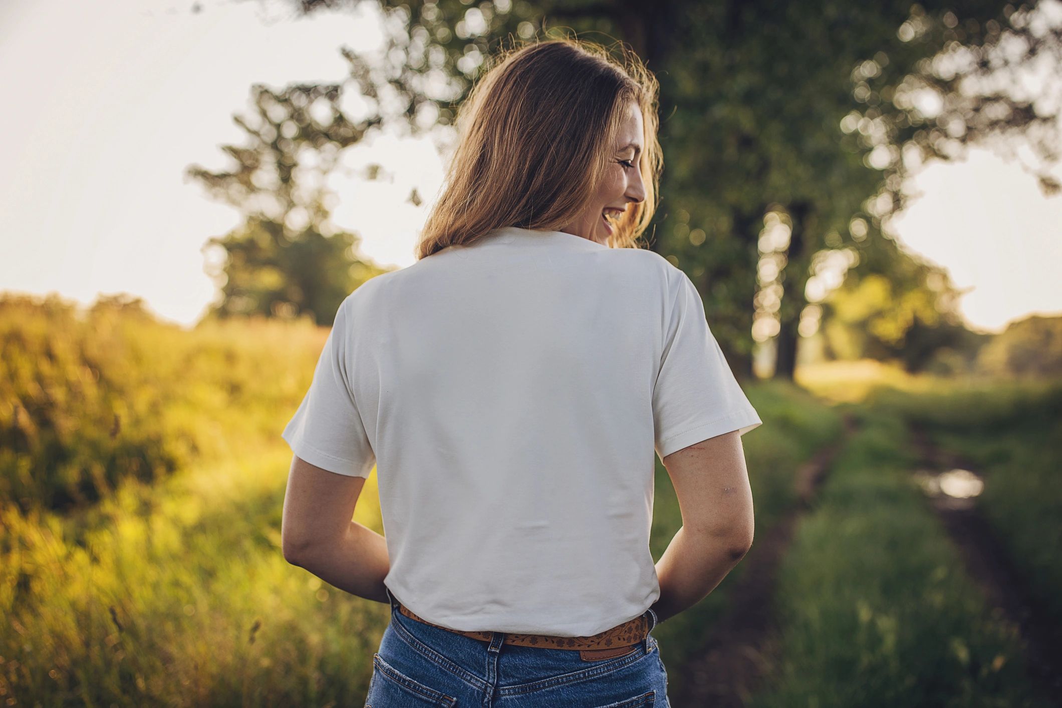 Muted rose beige unisex t-shirt with handwritten Past Tense text and heart motif, sad-girl indie aesthetic